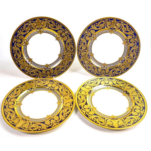 1090 - De Lamerie Fine Bone China heavily gilded Empress patterned set of four dinner plates, specially mad... 