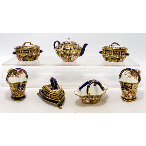 1254 - A collection of Royal Crown Derby miniature items in the 6299 Imari design, comprising a pair of mil... 