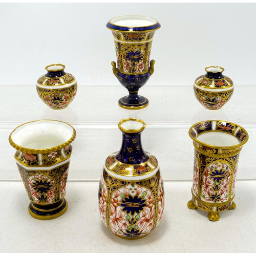 1257 - A collection of Royal Crown Derby miniature vases in the 1128 Imari design. (6)