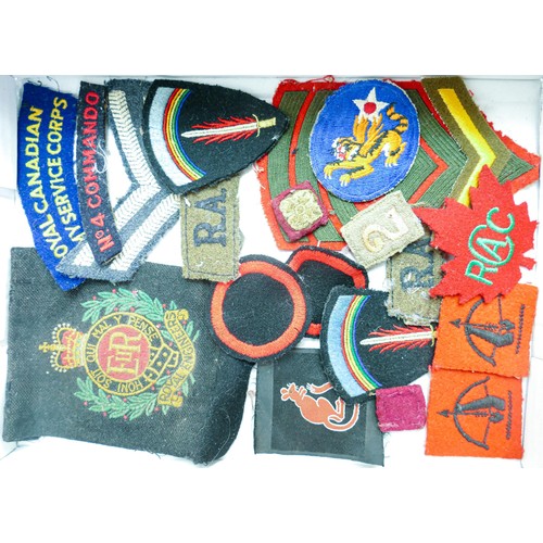 1577 - A collection of various military uniform badges, badges and patches, including Royal Engineers, Roya... 