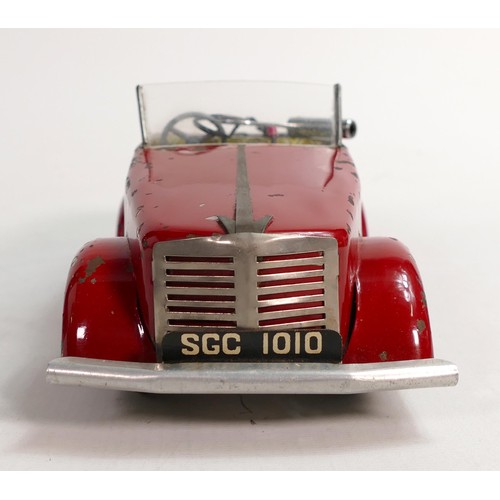 1666 - Louis Marx Toby Toys red sports car, c1950s, reg SGC1010, with key, working order, L.36.5cm. Played ... 