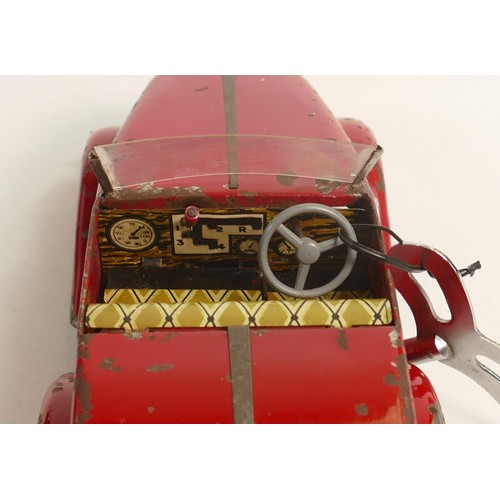 1666 - Louis Marx Toby Toys red sports car, c1950s, reg SGC1010, with key, working order, L.36.5cm. Played ... 