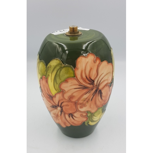 79 - Moorcroft hibiscus on green ground table lamp body (no fittings or cable etc), 20cm in height.