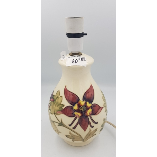 80 - Moorcroft columbine on cream ground table lamp, 27cm in height overall.