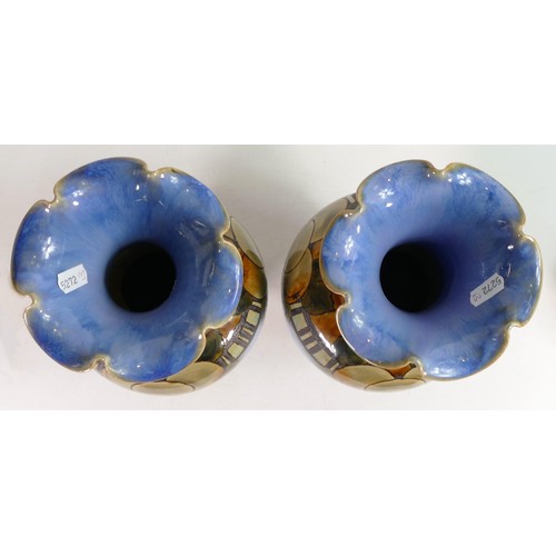 417A - Pair of Royal Doulton Lambeth vases by Eliza Simmance, both decorated all around with apples on a bl... 