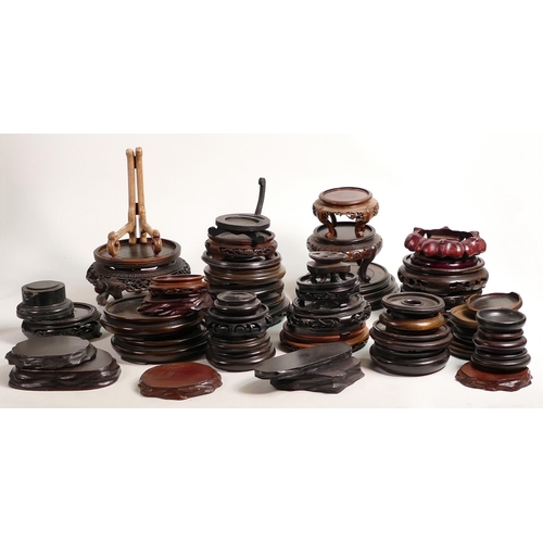 1725 - A large collection of 19th & later Chinese carved hardwood vase & figure stands.