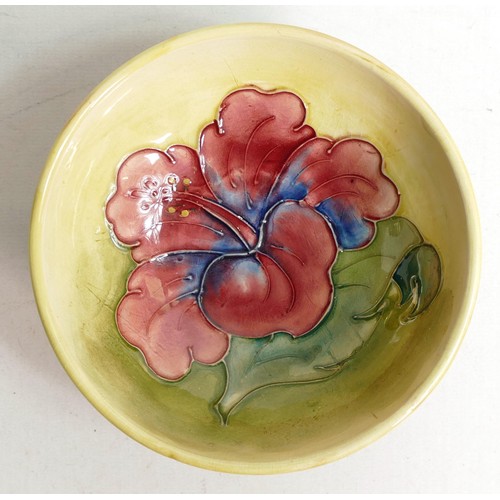 908 - Moorcroft Hibiscus small footed bowl.. Moorcroft paper label to base. Diameter 13.5cm.