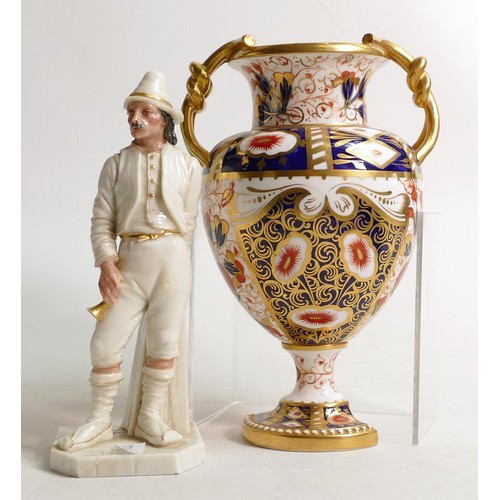 982 - Royal Worcester figure of a man holding a horn and an A Davenport two handled Imari urn, both of the... 