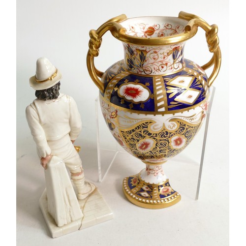 982 - Royal Worcester figure of a man holding a horn and an A Davenport two handled Imari urn, both of the... 