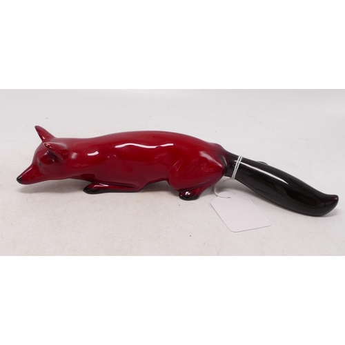 474 - Royal Doulton Flambe larger size laying fox, 23cm.  Glaze blemish to ear.