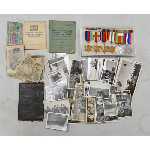 662 - A collection of medals and items belonging to a soldier, including a group of medals including Afric... 