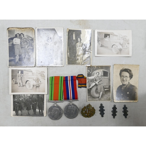 663 - Pair of medals Victory & Defence, with photographs & badges awarded to a woman.