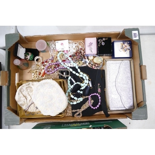 699 - A good collection of costume jewellery including bead, brooches, evening bags, earrings etc