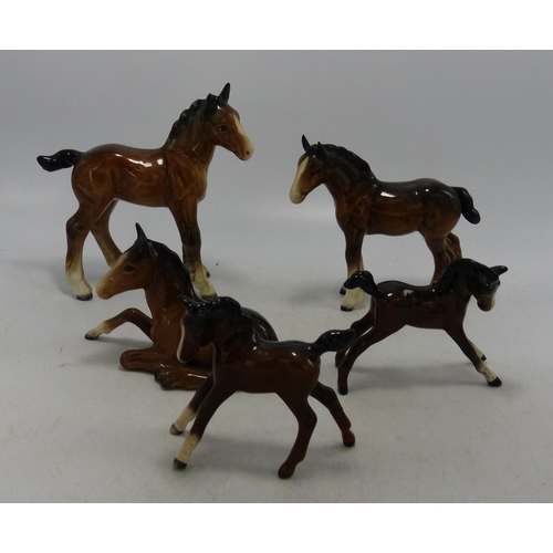 216 - Beswick Foals to include large & small shire foal, foal lying 915, stretched foal 815 etc (5)