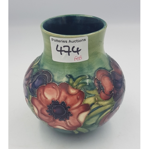 401 - Moorcroft Anemone pattern on graduated green ground vase, 12.5cm in height.