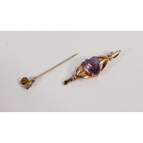 656 - 9ct rose gold bar brooch set with heart shaped purple stone, back pin broken,3g.