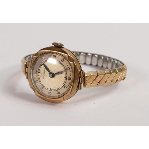 660 - 9ct gold ladies Medana wristwatch with gold plated expandable strap.