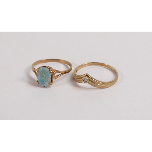 692 - 9ct diamond wishbone ring, size R, 1.4g and yellow metal ring set with oblong opal stone, 1.5g. (2)