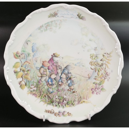 424 - A collection of Royal Doulton Wind in The Willows patterned plates, two with colour standard or Chri... 