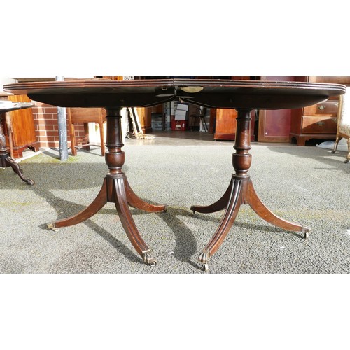 504 - 19th century mahogany D-end dining table on double tripod supports & fitted with brass castors (no e... 