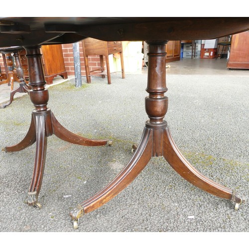 504 - 19th century mahogany D-end dining table on double tripod supports & fitted with brass castors (no e... 