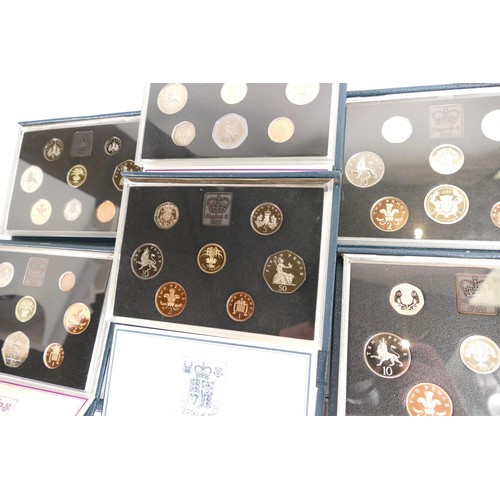 657 - A collection of United Kingdom proof coin sets by Royal mint. Comprising of 1983 x 2, 1984 x 2, 1985... 