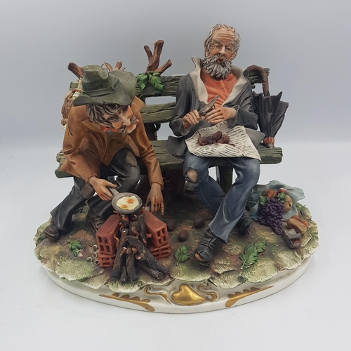 250 - Capodimonte Figure of two tramps sat on a bench