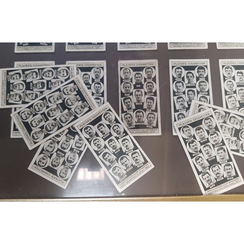 495A - A framed collection of Player's Cigarette cards depicting FA Cup winners from the late 19th and earl... 