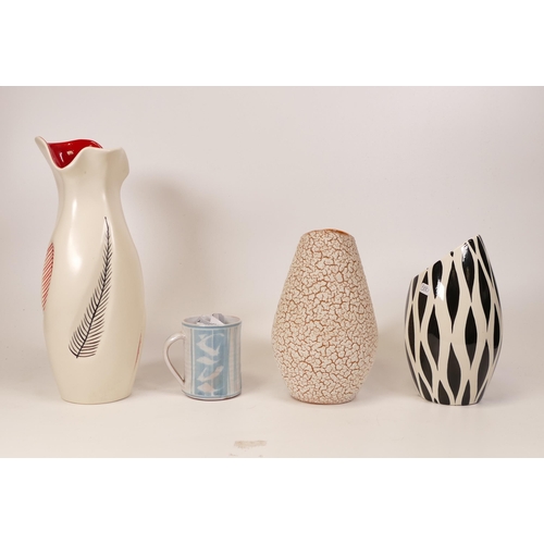 386 - Four ceramic vases to include Burleigh ware, zebrette vase and two similar. Height of tallest 25cm (... 