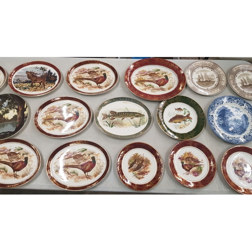 21 - A large collection of decorative wall plates mostly 'Weatherby Hanley' examples with wildlife theme ... 