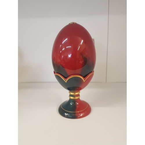 236 - Royal Doulton Flambé Egg on stand. Height 15cm.