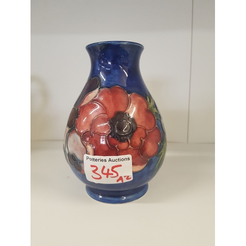 345 - Moorcroft Anenome pattern vase on mottled blue ground Height 13.5cm