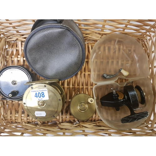 408 - Four fishing reels including brass centre pin by W J Cummins Bishop Auckland 2.5