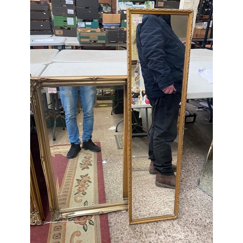 414 - A bevelled edged ornately framed wall mirror, together with a vintage hall mirror, bevelled edged mi... 