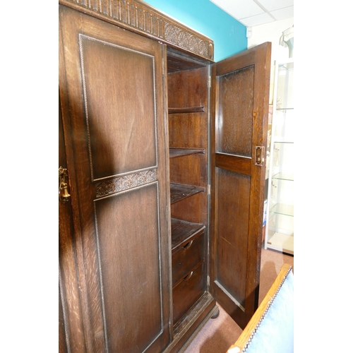 584 - Carved Oak Triple Wardrobe, with fitted smaller side, height 187cm, length 151cm & depth 45cm