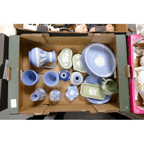 100 - A collection of multicolored Wedgwood Jasperware including  wall plates, vases, milk jug, lidded box... 