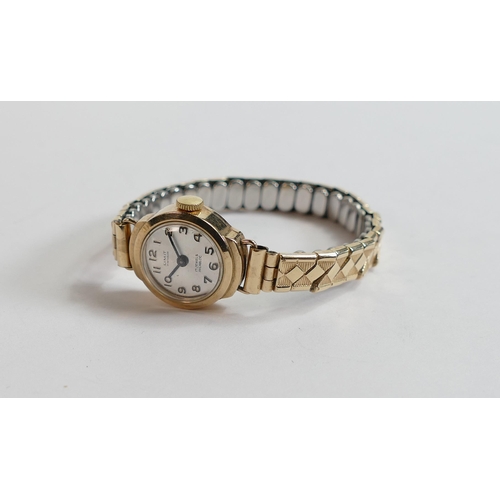 612 - Ladies 9ct gold Limit wristwatch with gold plated expandable bracelet.