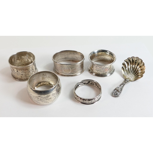 614 - A collection of Silver items including 5 serviette rings and ornate spoon,86.6g.