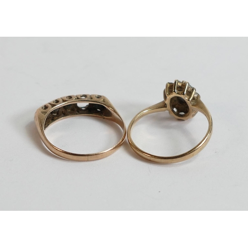 635 - Two 9ct gold rings set with with dark blue stones,3.5g, stone missing from 5 stone ring. (2)