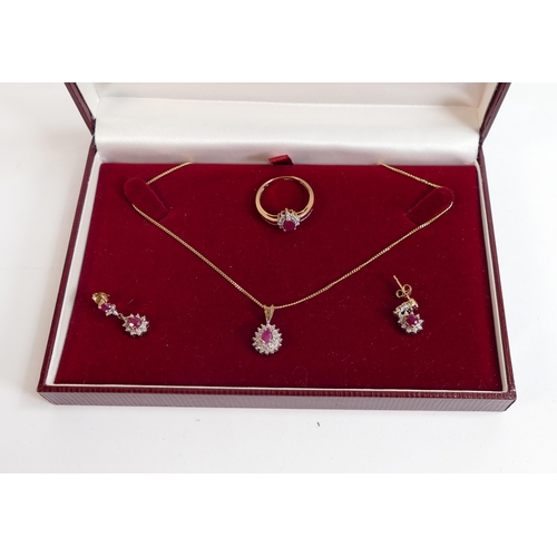 675 - 9ct gold matching jewellery set with red stones & diamonds, comprising pendant & chain, earrings and... 