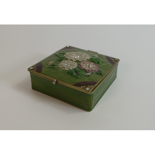 683 - A Enamelled floral jewellery box containing some costume jewellery.