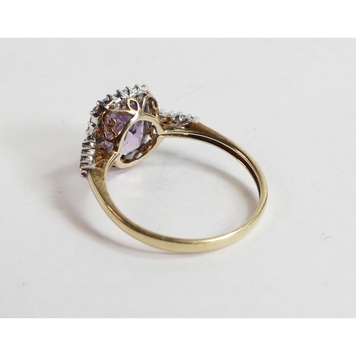 704 - 9ct gold QVC ladies ring set with purple stone, size R,2.5g.