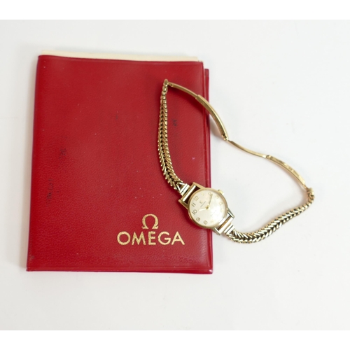 803 - Ladies Omega Geneve 9ct gold wristwatch with 9ct gold bracelet, with omega paperwork from 1974, gros... 