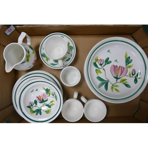 66 - A collection of Portmerion Magnolia tea and dinner ware to include shallow bowls, cups, saucers, sid... 