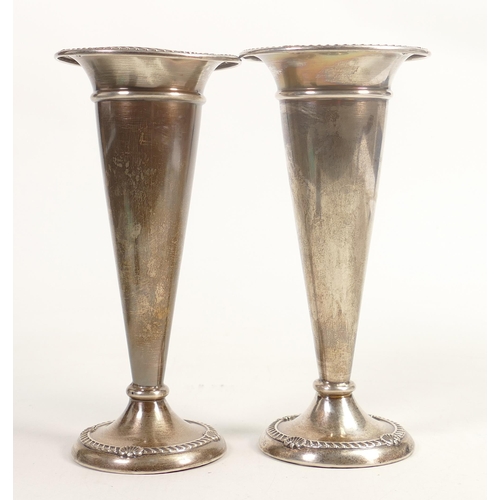 707 - Pair filled silver fluted vases dated 1921, h.19cm, gross weight 561.7g. Some damage noted - one vas... 