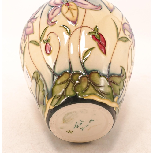 43 - Moorcroft trial vase in a floral design, dated 2008,h.20cm, boxed.