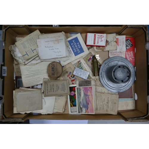 608 - A mixed collection of items to include WW2 military ephemera, trench art lighters, WW1 postcards etc