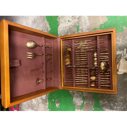 19 - Mid-century Extensive Cutlery Canteen containing two layers of Chinoiserie Gilt effect cutlery.