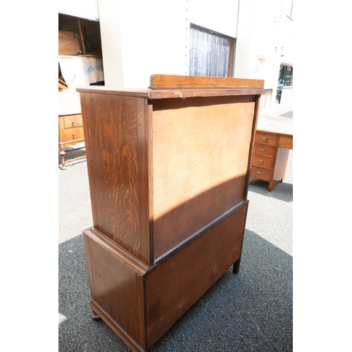 498 - 1930's oak chest on chest with enamelled handles. 132cm high, 92cm wide, 46cm deep