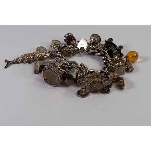 756 - Large & heavy silver charm bracelet, gross weight 171g gross.